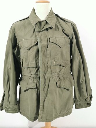 U.S. WWII M43 field jacket. Used, label faded, size Medium