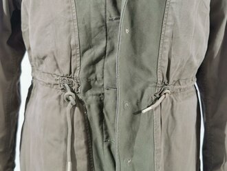 U.S. WWII M43 field jacket. Used, label faded, size Medium
