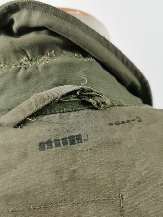 U.S. WWII M43 field jacket. Used, label faded, size Medium