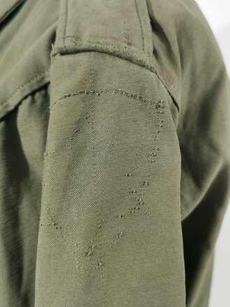 U.S. WWII M43 field jacket. Used, label faded, size Medium