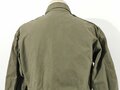 U.S. WWII M43 field jacket. Used, label faded, size Medium