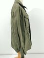 U.S. WWII M43 field jacket. Used, label faded, size Medium