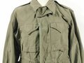 U.S. WWII M43 field jacket. Used, label faded, size Medium