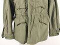 U.S. WWII M43 field jacket. Used, label faded, size Medium