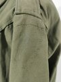 U.S. WWII M43 field jacket. Used, label faded, size Medium