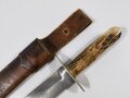 Bowie Knive with bone made handle shells and leather scabbard, "B&D", Blade 23 cm, total length 36 cm, good condition