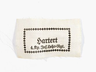 Wäscheetikett für einen Angehörigen  der "4. Kp.Inf. Lehr-Rgt.", ca. 3,5 x 6 cm, Textil, neuwertig