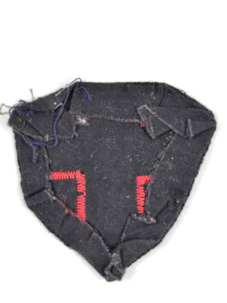 Stoffabzeichen, Rotes Kreuz mit blauer Figur auf schwarzem Grund
