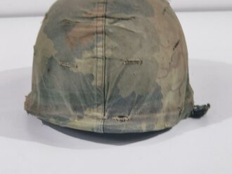 U.S. Vietnam era steel helmet. WWII front seam shell original painted, Liner dated 69, Mitchell pattern cover. Well used helmet