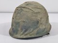 U.S. Vietnam era steel helmet. WWII front seam shell original painted, Liner dated 69, Mitchell pattern cover. Well used helmet