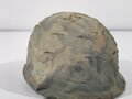 U.S. Vietnam era steel helmet. WWII front seam shell original painted, Liner dated 69, Mitchell pattern cover. Well used helmet